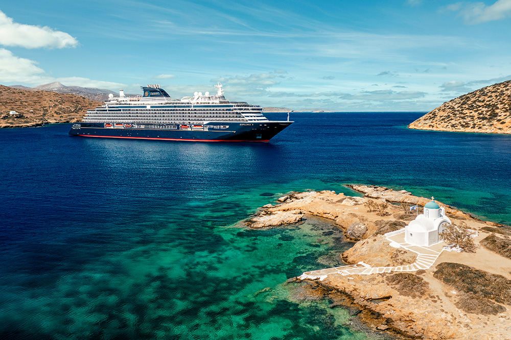 A grand cruise ship sailing the clear Mediterranean waters